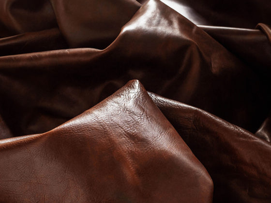 The processing of leather into a sofa cover